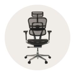 Black, ergonomic chair on a beige, round background